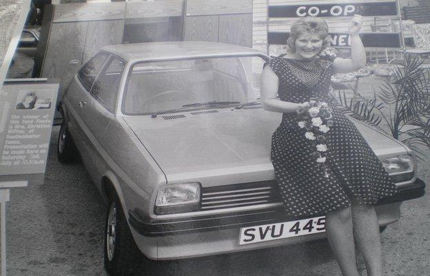 Christine Warren perched on a silver ford fiesta in 1977