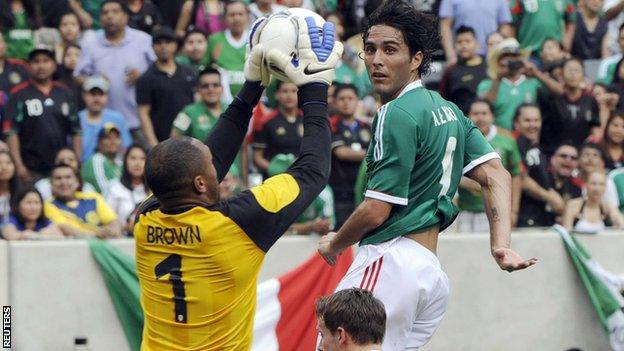 Wales goalkeeper Jason Brown saves a hader from Mexico goalscorer Aldo de Nigris