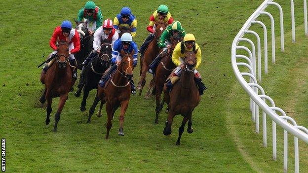 Riders rounding Tattenham Corner in the Derby