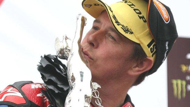 John McGuinness kisses the trophy after Saturday's victory