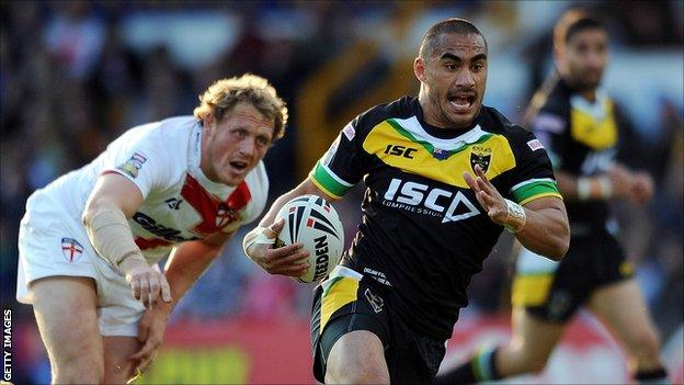 Thomas Leuluai runs clear of Ben Westwood during the International Origin match between England and Exiles at Headingley last June