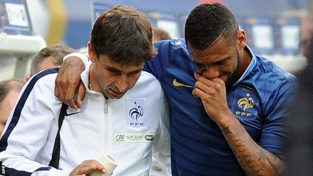 Yann M'Vila hobbles off for France