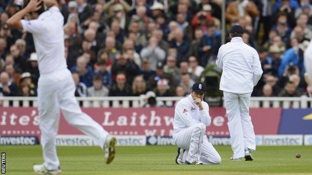 Graham Onions (left) reacts after teammate Ian Bell (centre) dropped a catch from the bat of West Indies' Adrian Barath