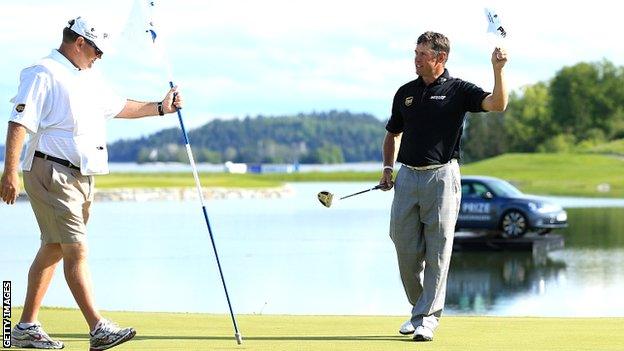 Lee Westwood with his new putter celebrating victory in Sweden