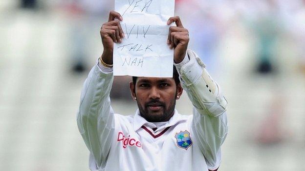 Denesh Ramdin holds up his note after making his century