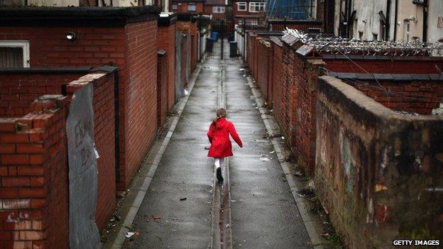 Girl playing in an alley