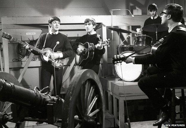 The Beatles performing in 1962 for their first studio recording in Manchester