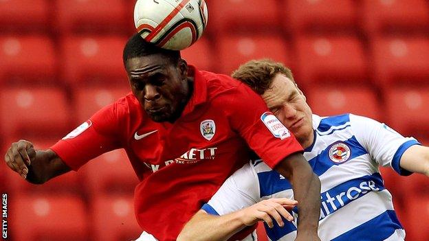 Frank Nouble (left) heads the ball during a loan spell at Barnsley