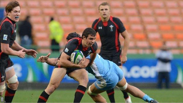 Wales scrum-half Tom Habberfield tests the Argentina defence