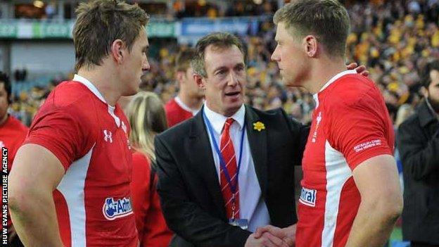 Rob Howley consoles Rhys Priestland and Jonathan Davies