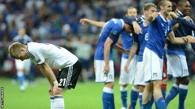 German midfielder Marco Reus is distraught as Italy's players celebrate