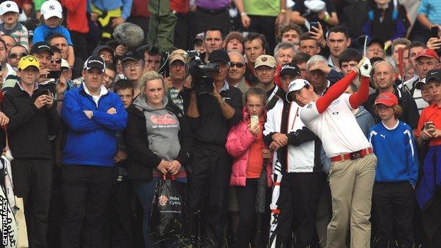 Rory McIlroy hits his second shot at the 17th ion Thursday