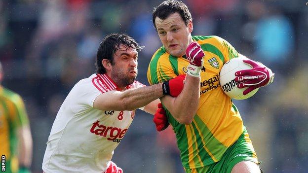 Joe McMahon of Tyrone challenges Donegal's Michael Murphy