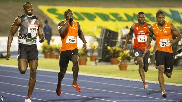 Usain Bolt and Yohan Blake run for the line in the 200m