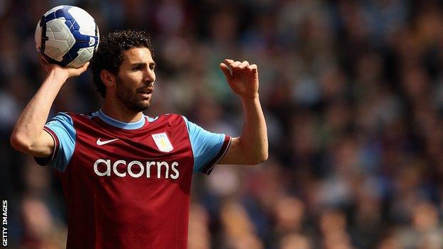 Carlos Cuellar takes a throw in for Aston Villa