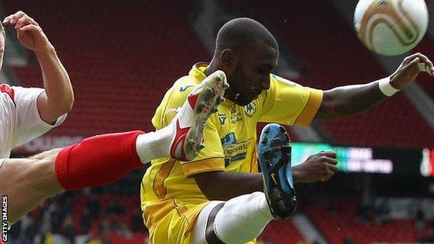 Lathaniel Rowe-Turner (right) in action for Torquay