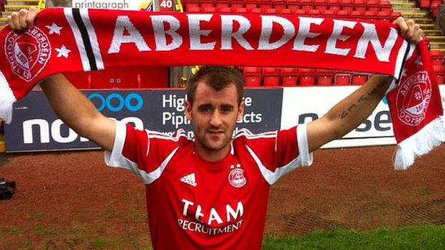 Niall McGinn shows off his new colours