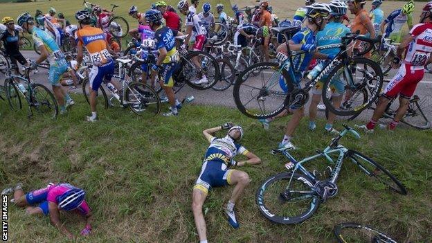 Wouter Poels (centre on grass) after the crash on stage six of the Tour de France