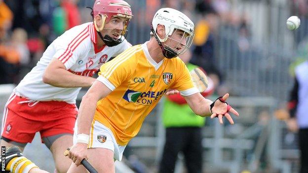 Antrim's Aaron Graffin battles with Derry's Kevin Hinphey at Casement Park