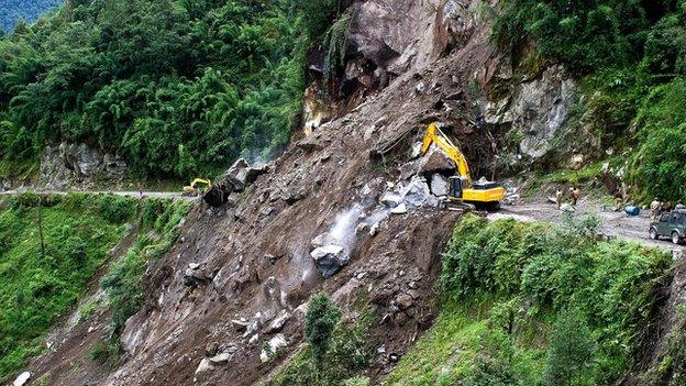 Indian personnel clear a landslip at Phengla