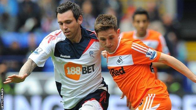 Mark Davies takes on Joe Allen in April 2012