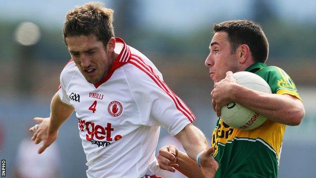 Tyrone's Dermot Carlin challenges Kerry's Declan O'Sullivan at Killarney