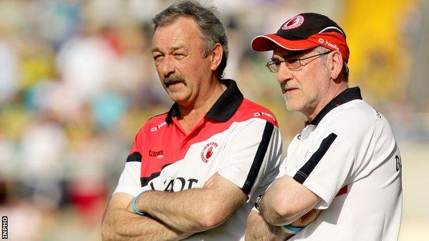 Mickey Harte [right] and his assistant Tony Donnelly watch the game in Killarney