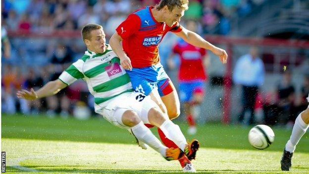 TNS defender Chris Marriott challenges Helsingborg's scorer Thomas Sørum