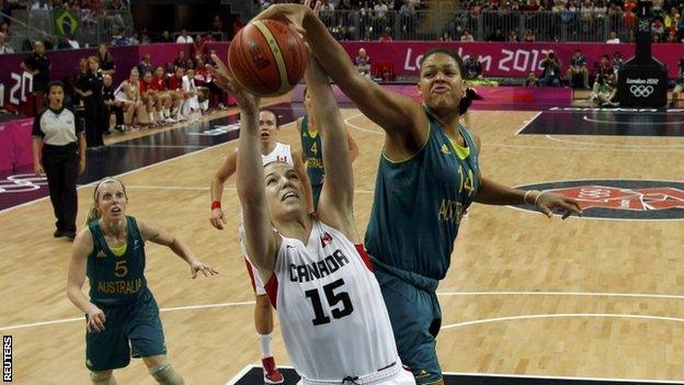 Australia's Liz Cambage tries to stop Canada's Michelle Plouffe