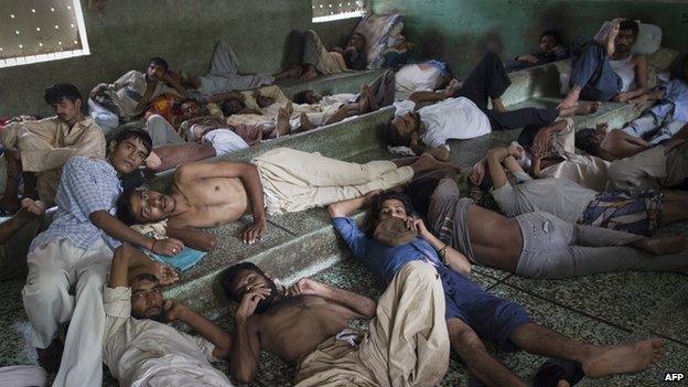 Pakistani heroin addicts rest at the Edhi rehabilitation centre in Karachi