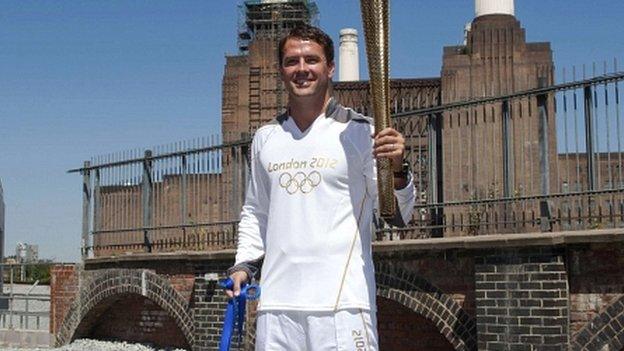 Michael Owen holds the Olympic torch