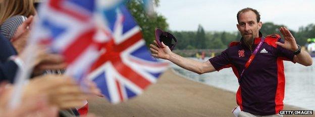 A Games Maker high fives fans in Hyde Park