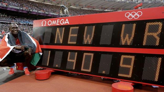 Rudisha next to his new world record time