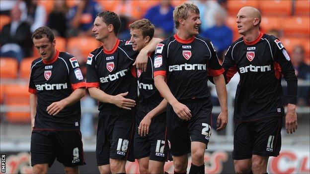 Morecambe players celebrate Andrew Fleming's goal against Blackpool