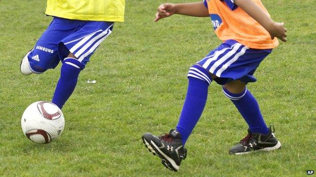 Kids playing football