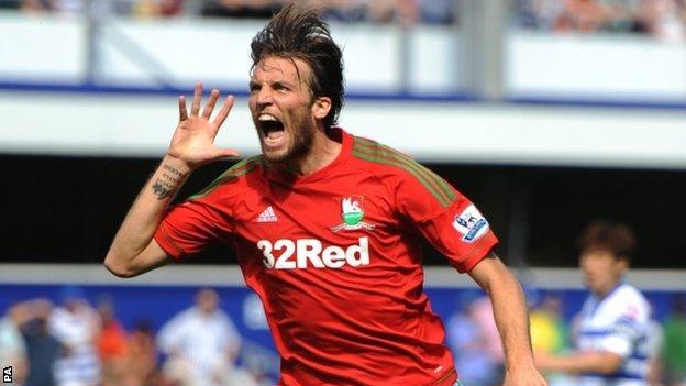 Michu celebrates after putting Swansea ahead