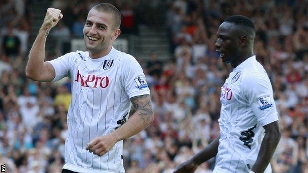 Mladen Petric (left) celebrates scoring for Fulham on his debut