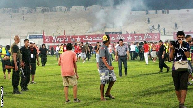 Etoile du Sahel fans invade the pitch during the 2-0 defeat by Esperance