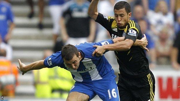 Wigan's James McArthur battles with Chelsea's Eden Hazard