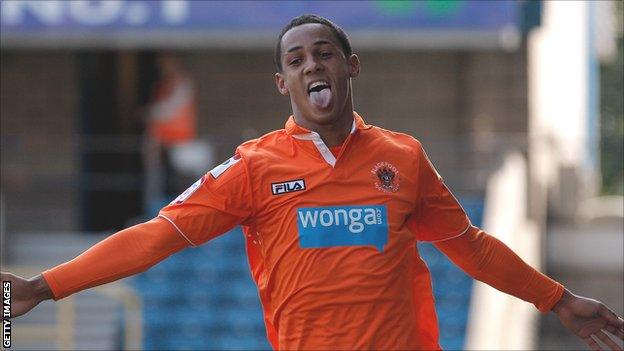 Blackpool winger Tom Ince celebrates one of his two goals at Millwall on Saturday