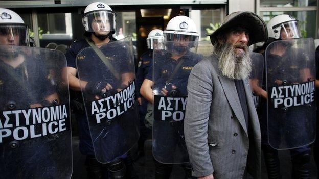 Greek pensioner with police