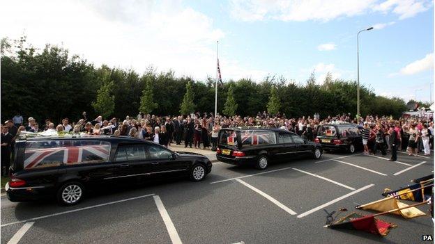 The cortege of three hearses passed through Carterton in Oxfordshire