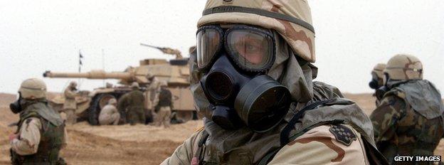 US soldiers in biochemical warfare suits