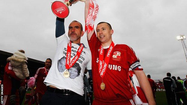 Paolo Di Canio and Paul Caddis lift the League Two trophy