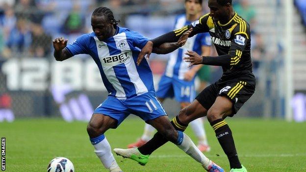 Wigan forward Victor Moses (left) in action against Chelsea