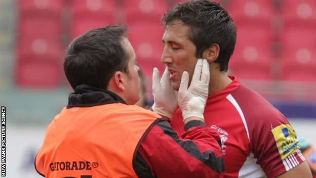 Gavin Henson receives treatment at Parc y Scarlets