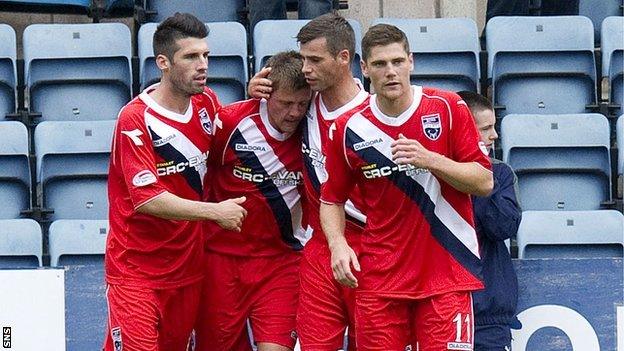 Ross County celebrate Richard Brittain's (second from left) penalty winner