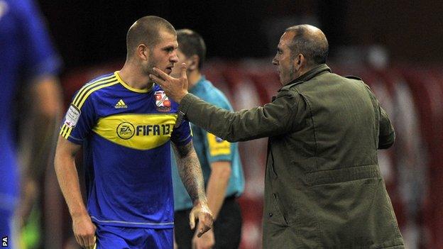 James Collins (left) and Swindon boss Paolo Di Canio