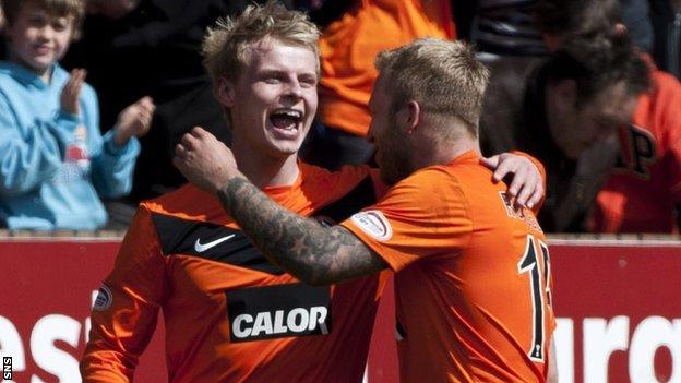 Gary Mackay-Steven and Johnny Russell celebrate with Dundee United