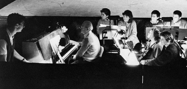 Paul Mason (left) and musicians